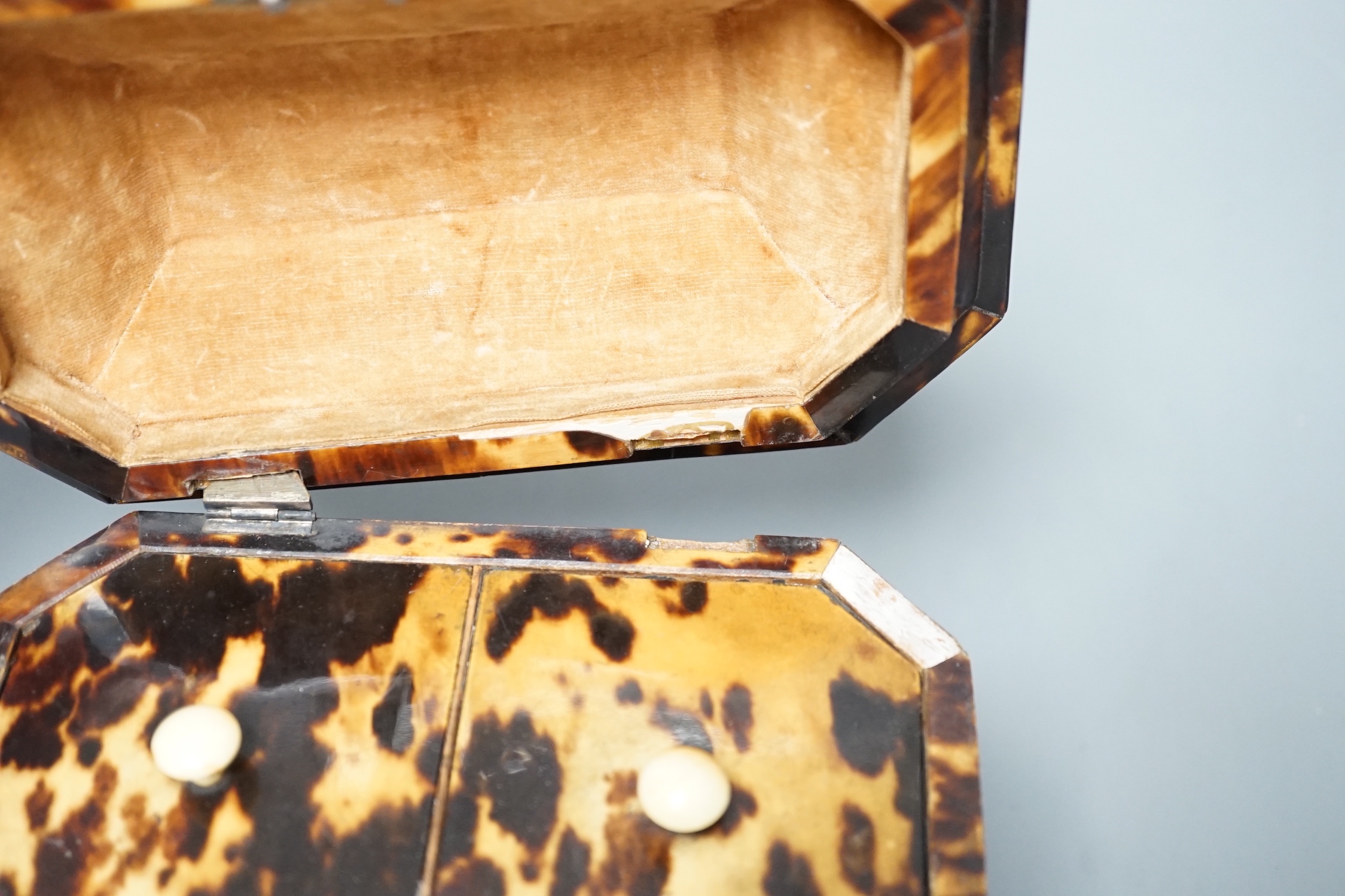 A Regency tortoiseshell bombe shaped two division tea caddy on ivory ball feet (Lid detached, requires restoration) - 18cm wide